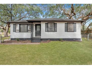 Charming home featuring freshly painted exterior, manicured lawn, and updated shutters at 1652 Larry St, North Charleston, SC 29405