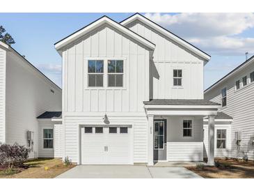 Beautiful two-story home with white siding and attached garage at 422 Queenview Ln, Charleston, SC 29414