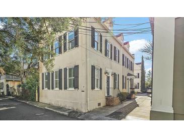 Charming multi-story home with classic architectural details and black shutters at 7 West St # C, Charleston, SC 29401