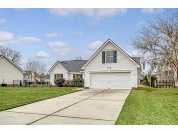 Charming single-story home with a two-car garage, well-manicured lawn, and classic curb appeal at 412 Hainesworth Dr, Charleston, SC 29414