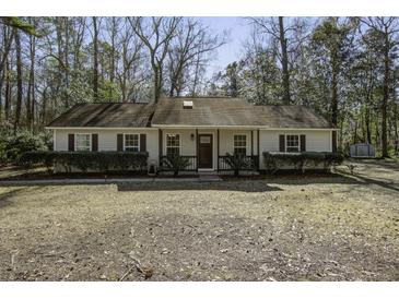 Charming single-story home featuring a classic design and cozy front porch at 3441 Berryhill Rd, Johns Island, SC 29455