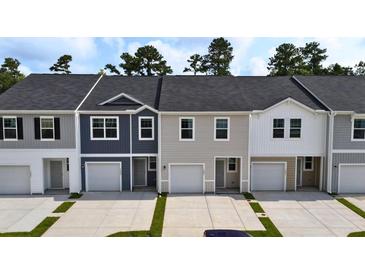 Charming townhomes showcasing unique architectural details and inviting curb appeal at 2104 Scarlett Maple St, Summerville, SC 29486