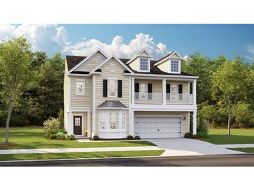 Charming two-story home with a welcoming front porch and a well-maintained yard at 593 Red Monarch Way, Moncks Corner, SC 29461