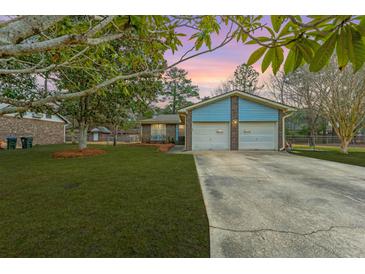 Charming single-Gathering home with a well-maintained lawn, two-car garage, and inviting curb appeal at 105 New Ct, Summerville, SC 29483