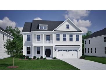 Charming two-story home featuring a second story balcony, attached two-car garage, and beautifully landscaped front yard at 151 Seaton Street, Summerville, SC 29486