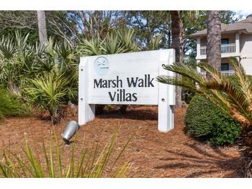 Marsh Walk Villas community sign amid lush landscaping and coastal foliage near the beach at 2012 Long Bend Drive, Seabrook Island, SC 29455