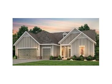 Charming one-story home featuring a two-car garage, gabled roof, and welcoming front porch at 2054 Cousteau Ct, Johns Island, SC 29455