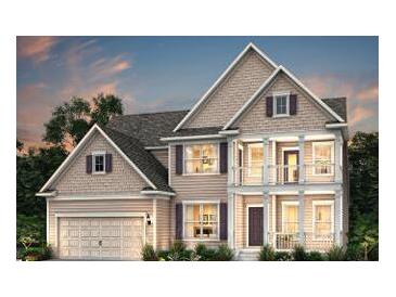 Charming two-story home boasts a covered porch, attached garage, and classic architectural details at 2106 Cousteau Ct, Johns Island, SC 29455