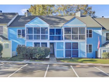 Charming, brightly colored townhome featuring screened porches and convenient parking at 105 Peacock Pl, Summerville, SC 29485