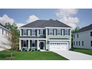 Charming two-story home featuring a two-car garage, a manicured lawn, and dark shutters on the windows at 160 Seaton Street, Summerville, SC 29486