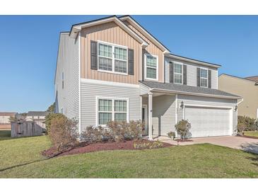 Charming two-story home featuring a blend of siding and a well-manicured lawn at 232 Decatur Dr, Summerville, SC 29486