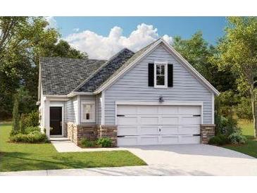 Charming single-Gathering home with a two-car garage, stone accents, and a well-manicured lawn at 1029 Sagegrass St, Summerville, SC 29485