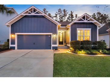 Charming home featuring a two-car garage, manicured lawn, and inviting entrance in a lovely neighborhood at 108 Whaler Ave, Summerville, SC 29486