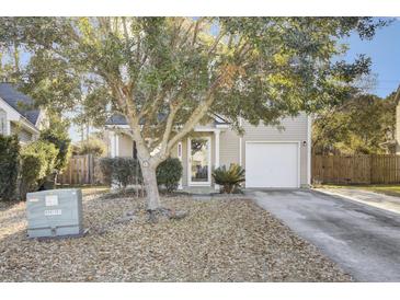 Charming single-Gathering home featuring mature landscaping, an attached one-car garage, and a welcoming front entrance at 112 Avonshire Dr, Summerville, SC 29483