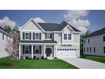 Charming two-story home with gray siding, black shutters, a covered porch, and an attached two-car garage at 135 Seaton Street, Summerville, SC 29486