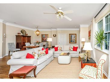 Bright and airy living room featuring neutral tones, comfortable seating, and abundant natural light at 1581 Cambridge Lakes Dr, Mount Pleasant, SC 29464
