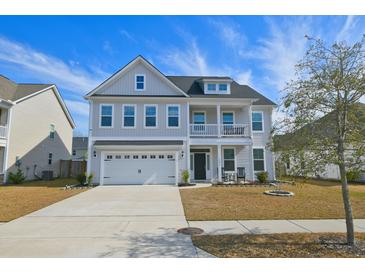 Charming two-story home with a two car garage, beautiful balcony and inviting curb appeal at 2905 Cavalcade Cir, Johns Island, SC 29455