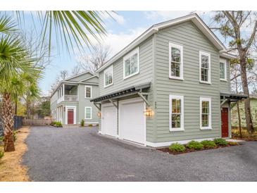 Charming two-story home with a two car garage and lovely landscaping at 493 Woodland Shores Rd, Charleston, SC 29412