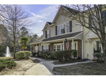 Charming two-story home with well-maintained landscaping and a welcoming front porch at 901 Elm Hall Cir, Summerville, SC 29483