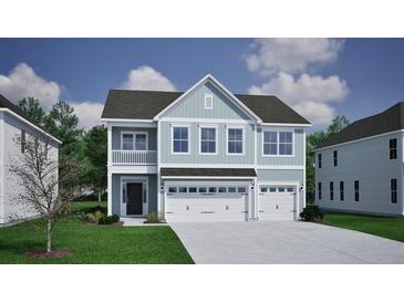 Charming two-story home with a three car garage and a welcoming front porch at 130 Seaton Street, Summerville, SC 29486