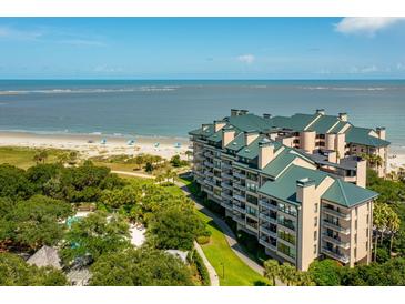 Beautiful oceanfront condos offering lush landscaping, beach access, and stunning views of the coast at 1401 Ocean Club Dr, Isle of Palms, SC 29451