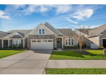 Charming single-story home with a two-car garage and manicured lawn at 2014 Barn Swallow Rd, Summerville, SC 29483
