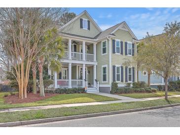 Charming two-story home with double porches, neat landscaping, and traditional shutters at 2615 Rutherford Way, Charleston, SC 29414