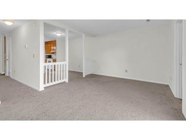 Bright living room featuring neutral carpet and an opening to the kitchen at 4722 Whitwil Blvd, North Charleston, SC 29418