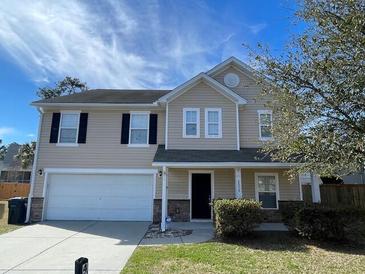 Charming two-story home featuring a two-car garage and well-maintained lawn at 4804 Coopers Ct, Summerville, SC 29485