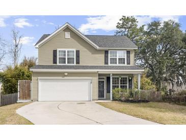 Charming two-story home with a well-maintained lawn, attached garage, and inviting curb appeal at 2005 Nitsa St, Johns Island, SC 29455
