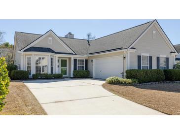 Charming home featuring a two-car garage, well-manicured bushes, and a concrete driveway at 2080 Bancroft Ln, Mount Pleasant, SC 29466