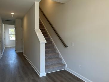 Entryway with wood flooring, a staircase with carpeted steps and natural light at 5122 Double Eagle, Summerville, SC 29485