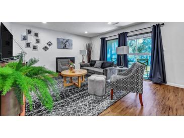 Cozy living room with plush seating, elegant decor, and lots of natural light at 87 Ashley Hall Plantation Rd # 108, Charleston, SC 29407