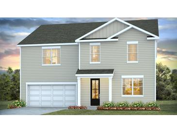 Charming two-story home featuring a two-car garage and a welcoming front porch at 134 Lilac Grove Way, Summerville, SC 29486