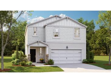 Charming two-story home with landscaped yard and inviting curb appeal at 311 Pine Crest View Dr, Summerville, SC 29486