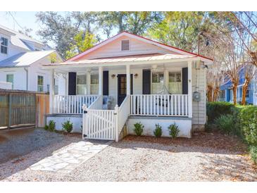 Charming single-story home with a cozy front porch and a well-maintained, landscaped yard at 721 Royall Ave, Mount Pleasant, SC 29464
