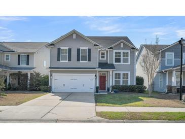 Charming two-story home with gray siding, black shutters, a red door, and a two-car garage at 231 Laurel Crest Way, Summerville, SC 29486