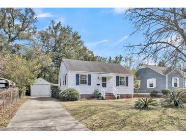 Charming single-story home with white siding, blue shutters and a detached garage at 4816 Chesterfield Rd, North Charleston, SC 29405