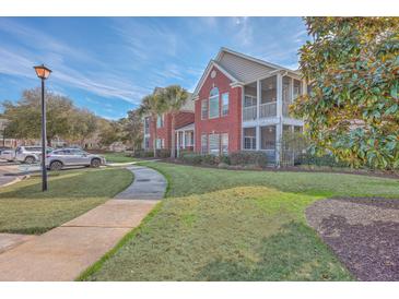 Beautiful two-story building with red brick, a sidewalk and landscaping at 1338 Hopton Cir, Mount Pleasant, SC 29466