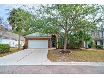 Charming brick home with a two-car garage and mature trees in a desirable neighborhood at 2128 Baldwin Park Dr, Mount Pleasant, SC 29466