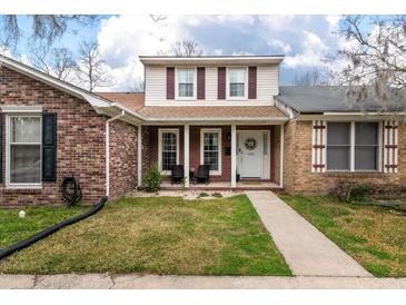 Charming two-story brick home with well-maintained lawn and inviting front porch at 4336 Purdue Dr, North Charleston, SC 29418