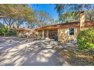 Spacious home exterior featuring a covered patio and ample parking at 29 Wendy Lane, Charleston, SC 29407
