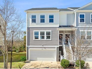 Charming two-story townhome with gray siding, white trim, and a one-car garage at 591 Mclernon Trace, Johns Island, SC 29455