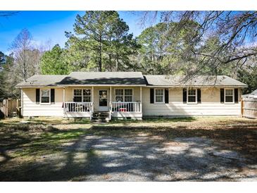 Charming single-story home featuring a cozy front porch and classic curb appeal at 106 Harriet Tubman Ln, Moncks Corner, SC 29461