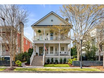Charming two-story home with double porches and landscaped yard, welcoming entryway with brick steps at 3019 Viscount St, Charleston, SC 29424