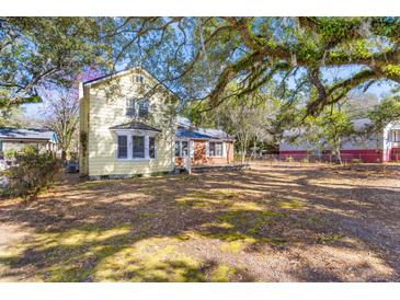 Charming two-story home with a brick addition surrounded by beautiful, mature trees at 1124 Berkeley St, Hanahan, SC 29410
