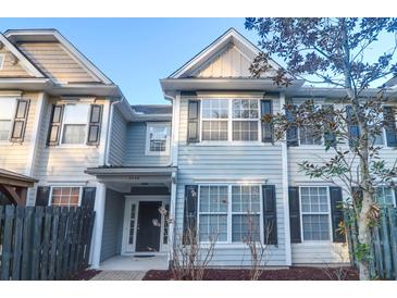Inviting townhome exterior with neutral siding, black shutters, and well-maintained landscaping at 3049 Park West Blvd, Mount Pleasant, SC 29466