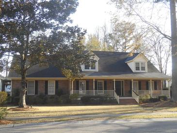 Charming brick home with a welcoming front porch and well-maintained landscaping at 315 King Charles Cir, Summerville, SC 29485