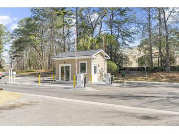 Community guard house for gated neighborhood with gate access, ensuring privacy and security at 7932 Riverbirch Ln, North Charleston, SC 29418