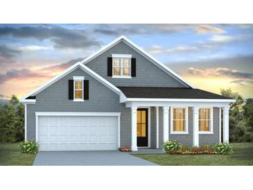 Charming single-Gathering home featuring a two-car garage and inviting front porch with white columns at 2254 Macallan Blvd, Ravenel, SC 29470